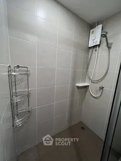 Modern bathroom with tiled shower and water heater