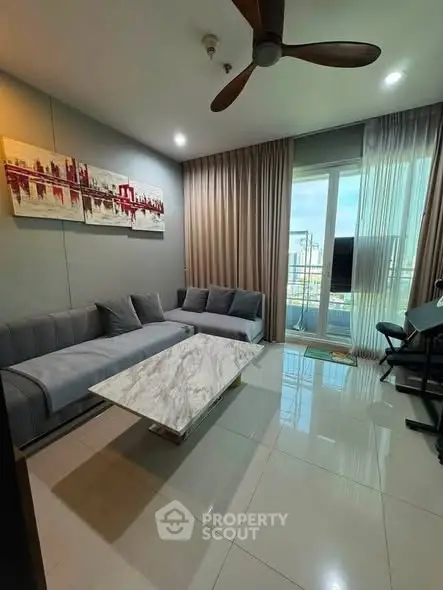 Modern living room with stylish decor and balcony view