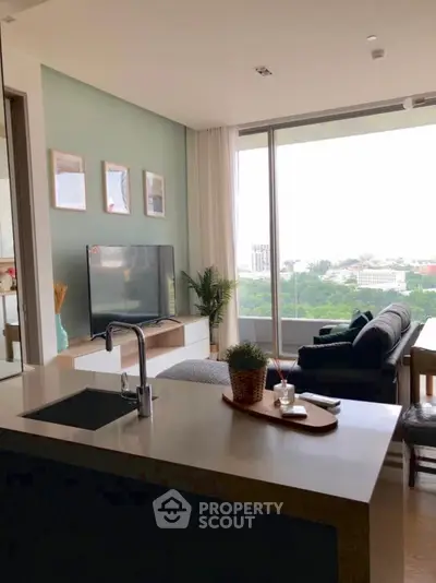 Modern living room with large window and scenic view, featuring sleek furniture and stylish decor.