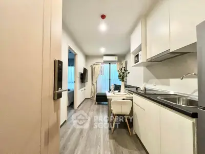 Modern open-layout kitchen and dining area with sleek design and natural light.