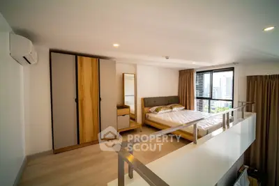 Modern loft bedroom with city view and stylish wooden furniture