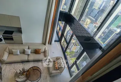 Luxurious high-rise apartment with stunning city views and modern open-plan living area.