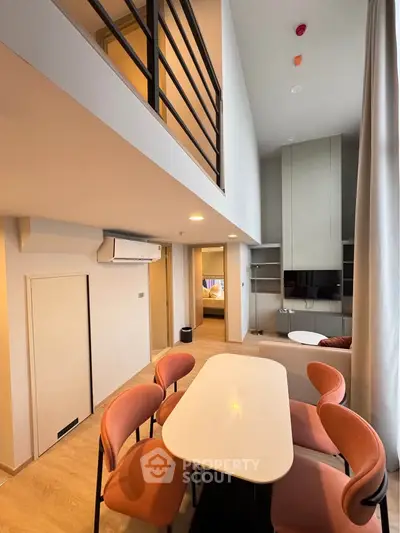 Modern loft apartment with high ceilings and stylish dining area