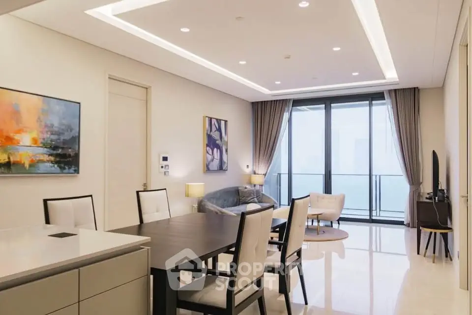 Luxurious modern living room with elegant dining area and large balcony view.