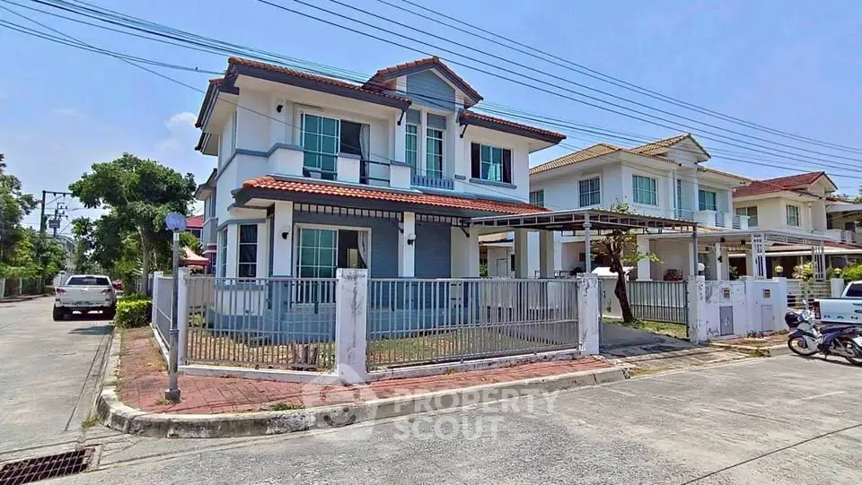 Charming two-story house with fenced yard in a serene neighborhood, perfect for family living.