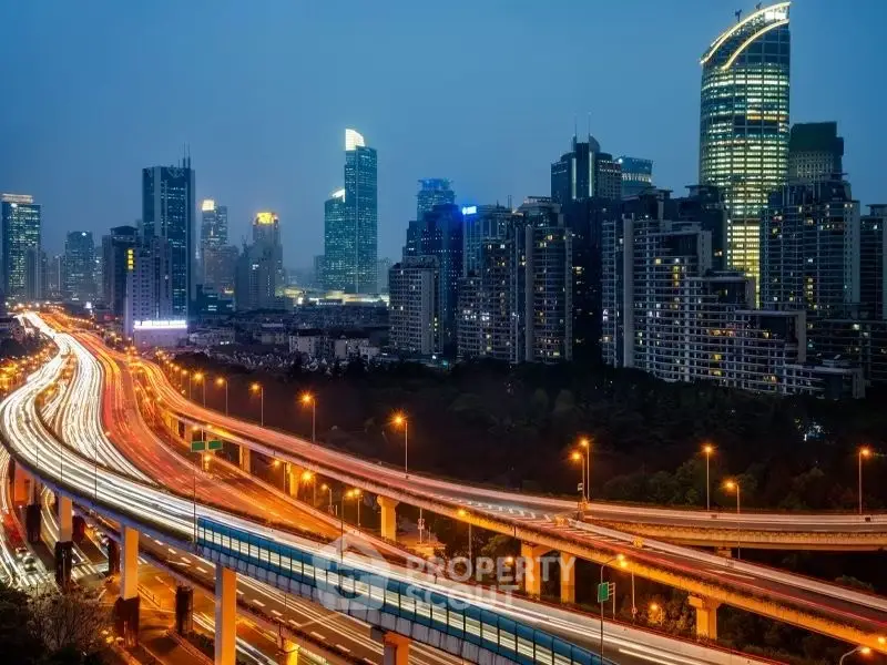 Stunning cityscape view with illuminated skyscrapers and bustling highway at dusk.