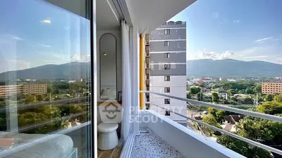Stunning balcony view with mountain backdrop and modern cityscape