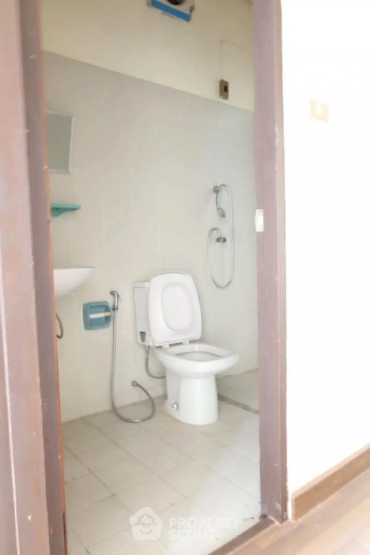 Compact bathroom with shower and toilet in minimalist design