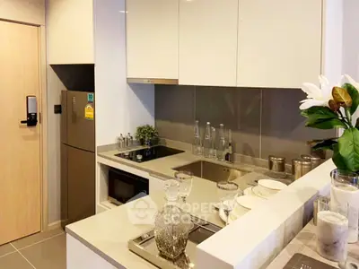 Modern kitchen with sleek cabinetry and built-in appliances in a stylish apartment.