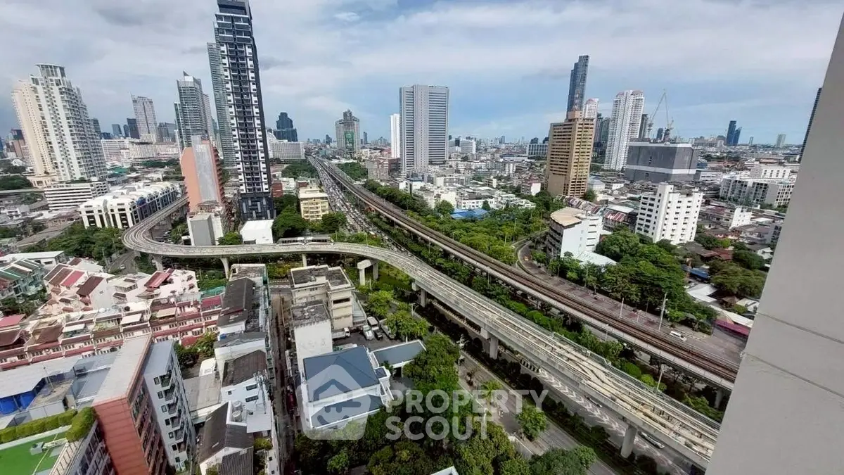 Stunning cityscape view with modern skyscrapers and elevated highways, perfect for urban living.