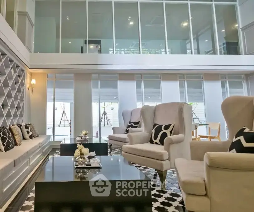 Luxurious modern living room with high ceiling and elegant decor