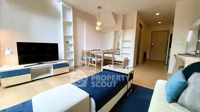 Modern living room with stylish furniture and open layout in a bright apartment.