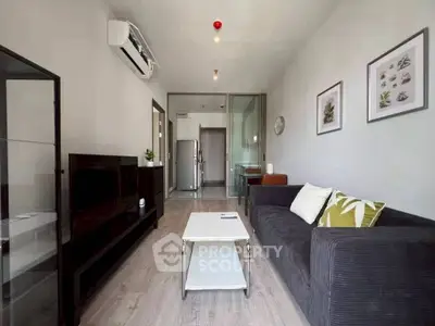 Modern living room with sleek furniture and air conditioning in a stylish apartment.