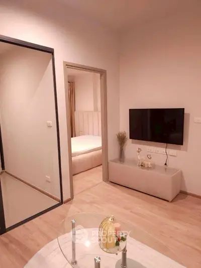 Modern apartment interior with stylish living room and cozy bedroom view.