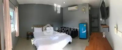 Spacious bedroom with modern amenities and natural light