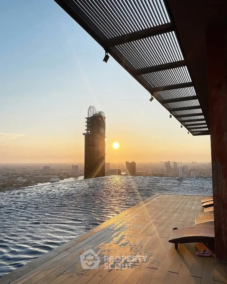 Stunning rooftop infinity pool with breathtaking city skyline view at sunset.