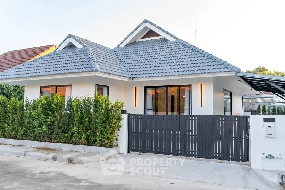 Charming modern house with sleek design and lush greenery, perfect for family living.