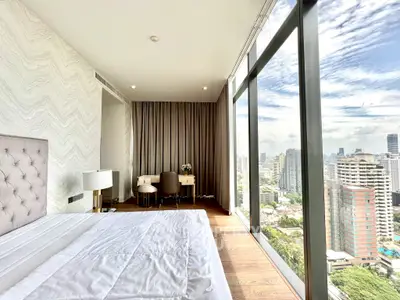 Luxurious bedroom with stunning city view and elegant decor