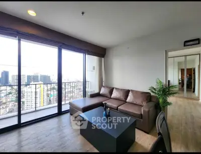 Spacious living room with stunning city view and modern furnishings