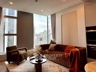 Modern living room with city view, stylish furniture, and floor-to-ceiling windows.