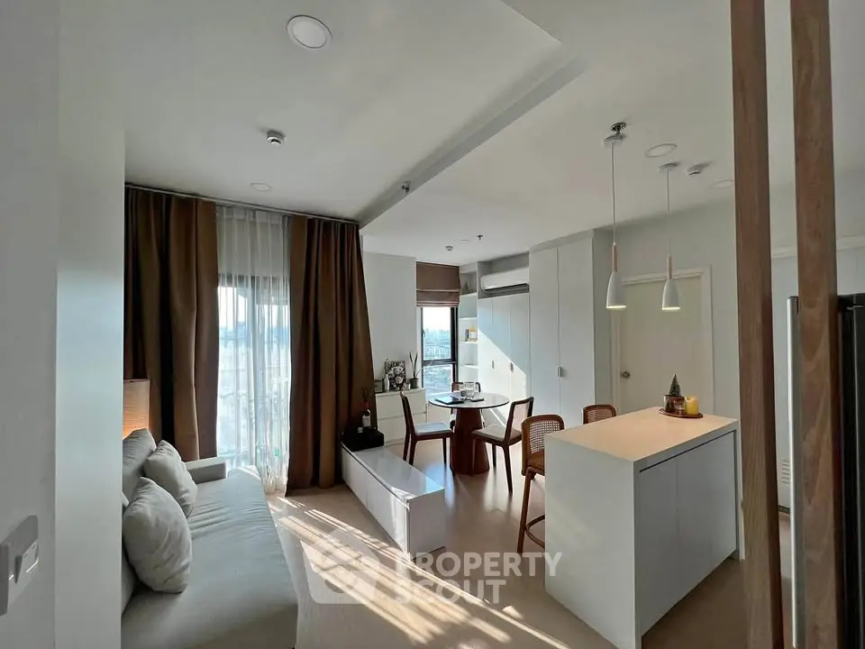 Modern open-layout living room with dining area and natural light
