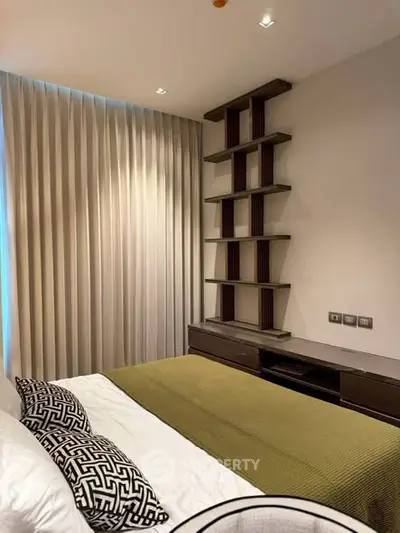 Modern bedroom with stylish shelving and elegant curtains