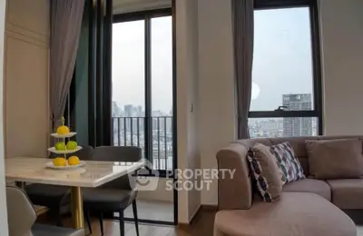 Modern living room with city view and stylish dining area