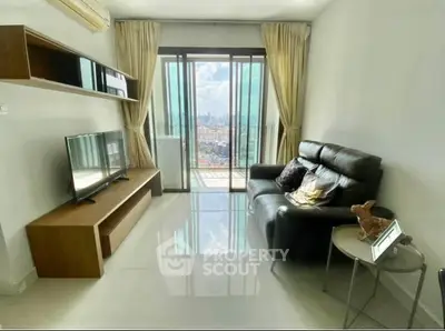 Modern living room with city view, sleek furniture, and natural light through large windows.