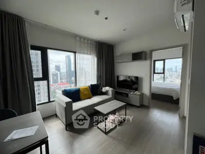 Modern living room with city view in high-rise apartment