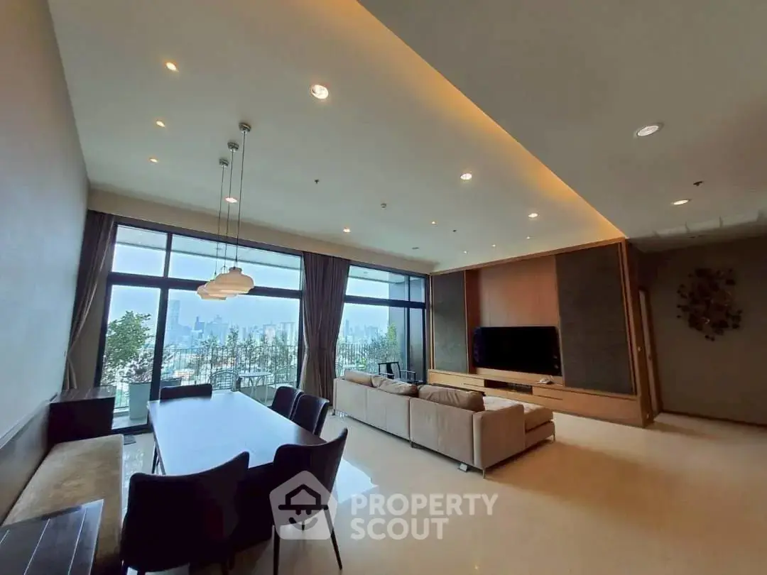 Spacious living room with city view, modern furniture, and elegant lighting in a high-rise apartment.