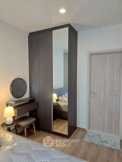 Modern bedroom with sleek wardrobe and cozy lighting