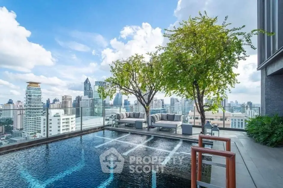 Luxurious rooftop pool with stunning city skyline view, perfect for relaxation and entertainment.