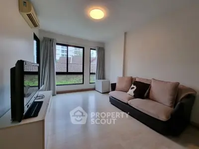 Cozy living room with modern sofa and large window view