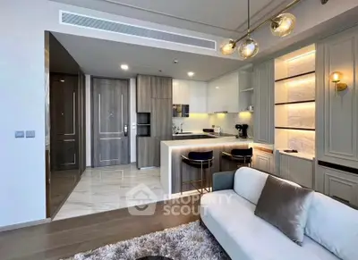 Modern open-layout living room with stylish kitchen and elegant lighting
