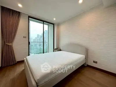 Spacious bedroom with city view and modern decor