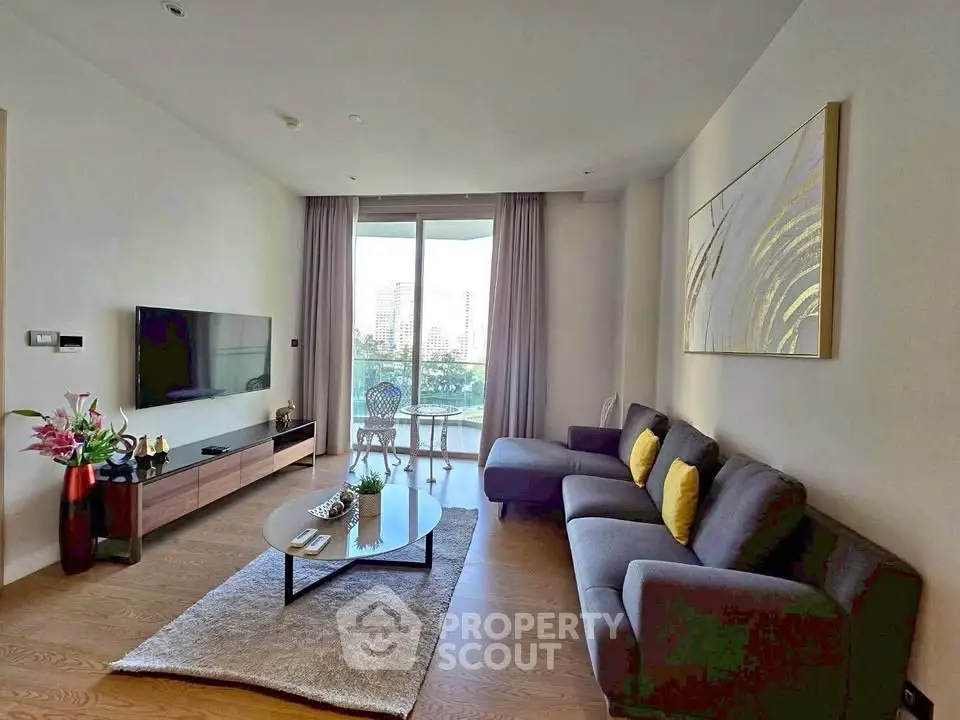 Spacious modern living room with large window and stylish decor