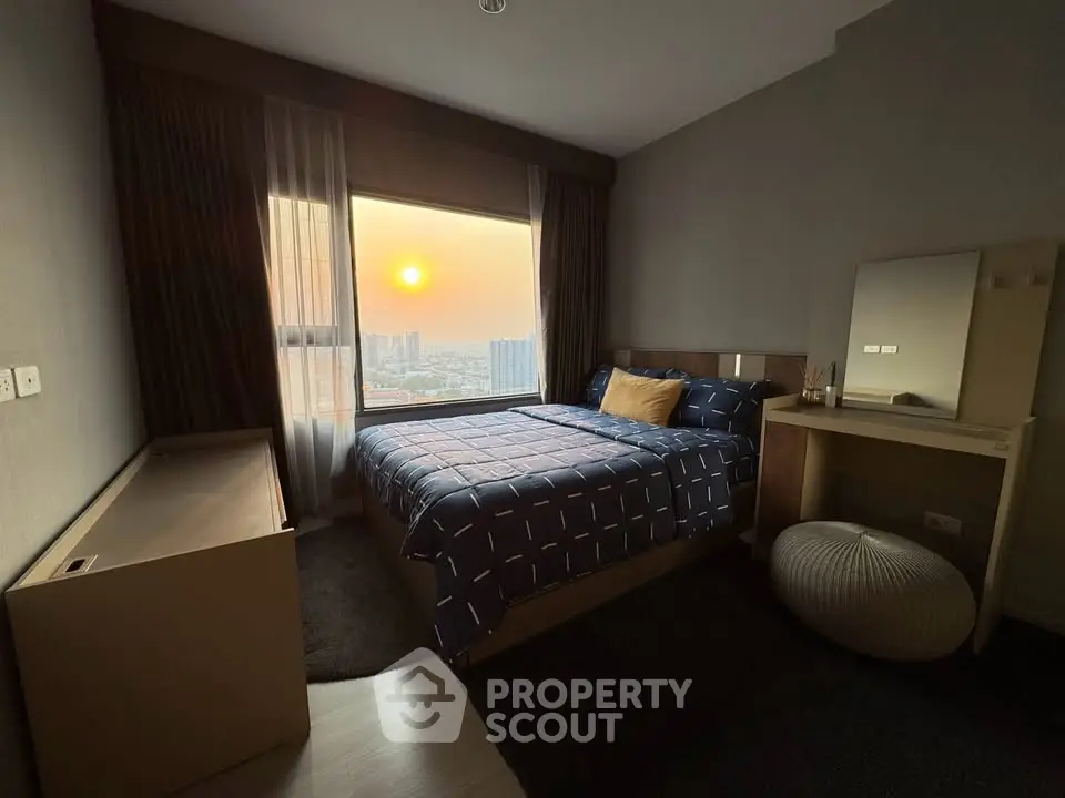Cozy bedroom with sunset view, modern decor, and stylish furnishings.