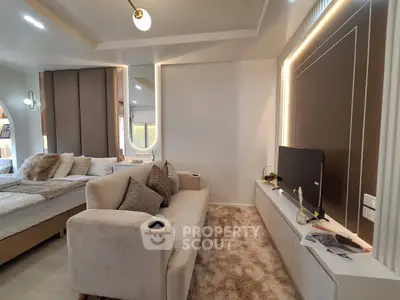 Luxurious modern living room with plush sofa and stylish decor in open-plan apartment