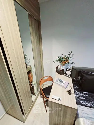 Cozy bedroom with modern wooden wardrobe and stylish decor