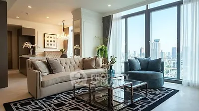 Luxurious living room with stunning city view, elegant furniture, and modern decor in high-rise apartment.