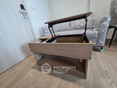 Modern living room with stylish lift-top coffee table and cozy sofa, perfect for contemporary urban living.