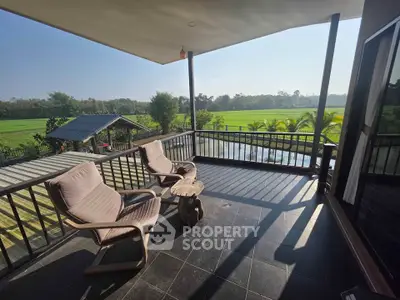 Spacious balcony with scenic countryside view, perfect for relaxation and outdoor enjoyment.