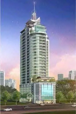 Stunning modern high-rise building with sleek glass facade and lush greenery, perfect for urban living.