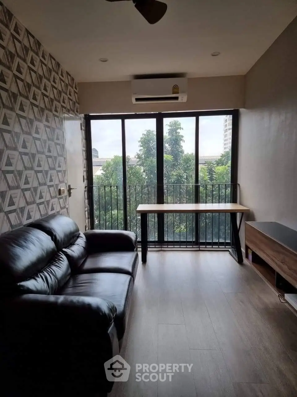 Chic living room with modern decor and balcony view