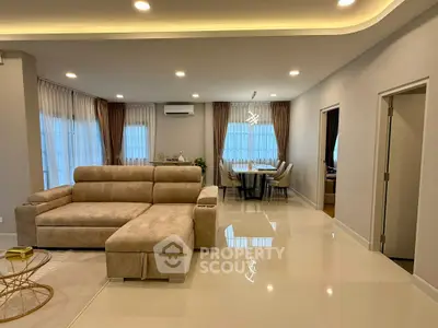 Spacious modern living room with elegant dining area and stylish furniture