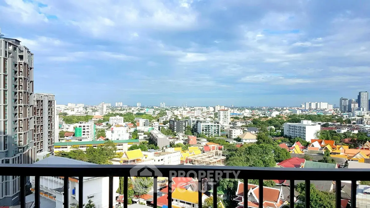 Stunning cityscape view from a high-rise balcony with expansive skyline.