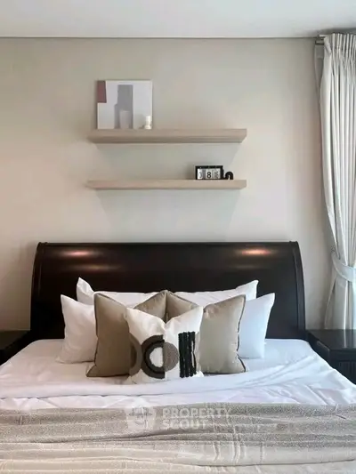 Elegant bedroom with stylish decor and cozy bedding, perfect for relaxation.