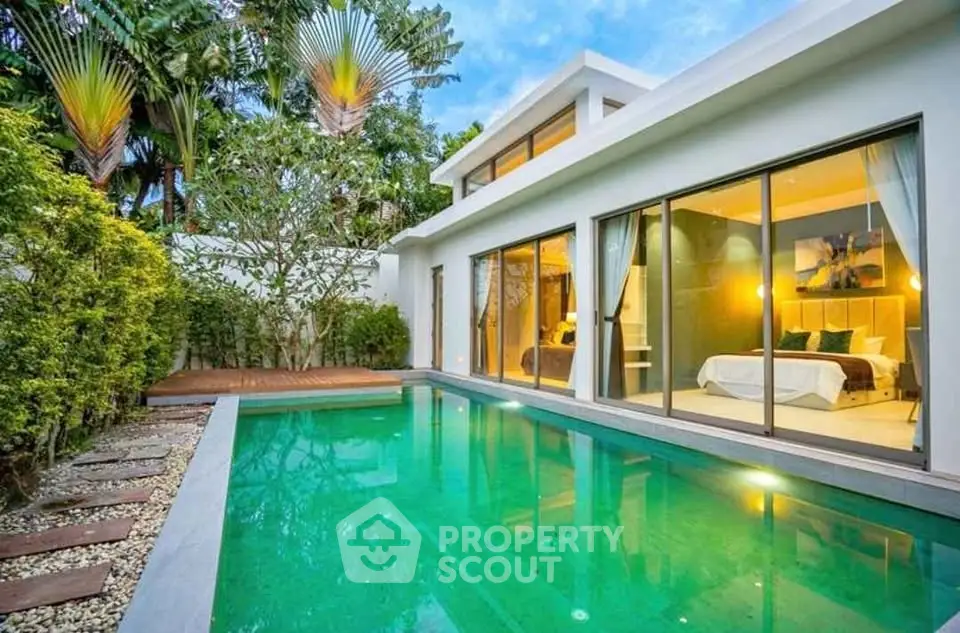 Luxurious modern villa with private pool and lush garden view