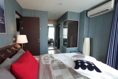 Modern bedroom with stylish decor and air conditioning in a luxury apartment.