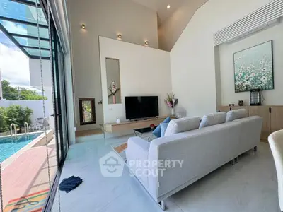 Luxurious living room with pool view and modern decor